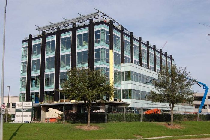 The SEI office building under construction with a lift at the facade